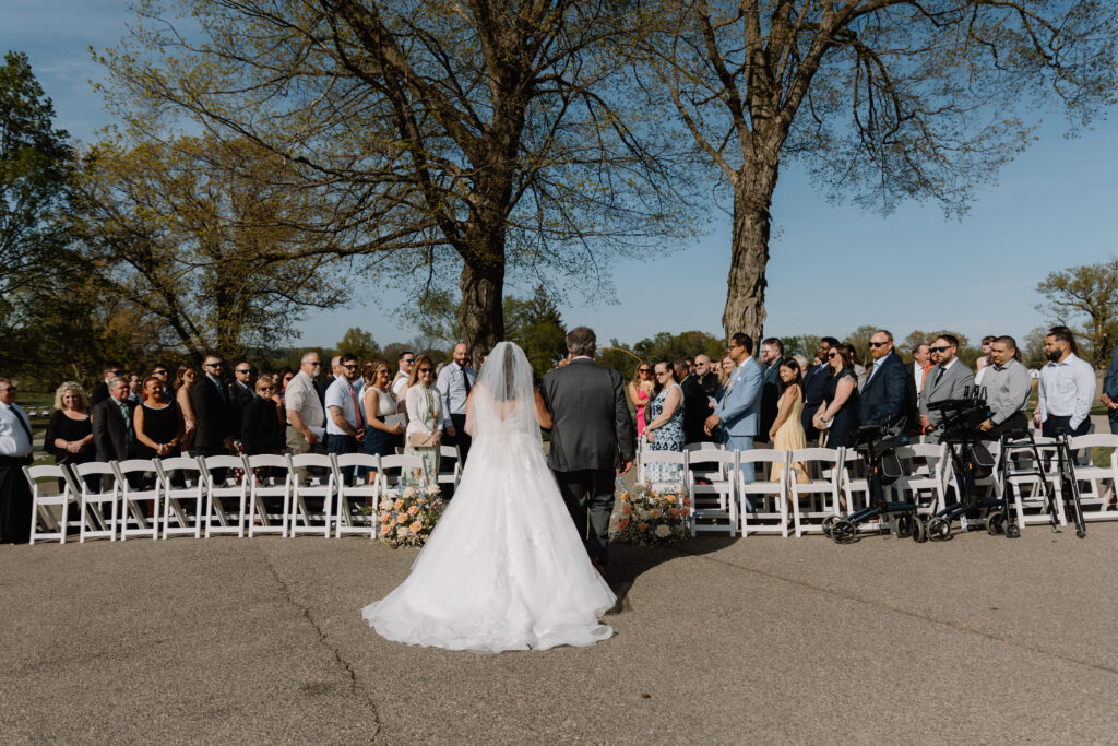 Bride walking down the aisle at Flourtown Country Club