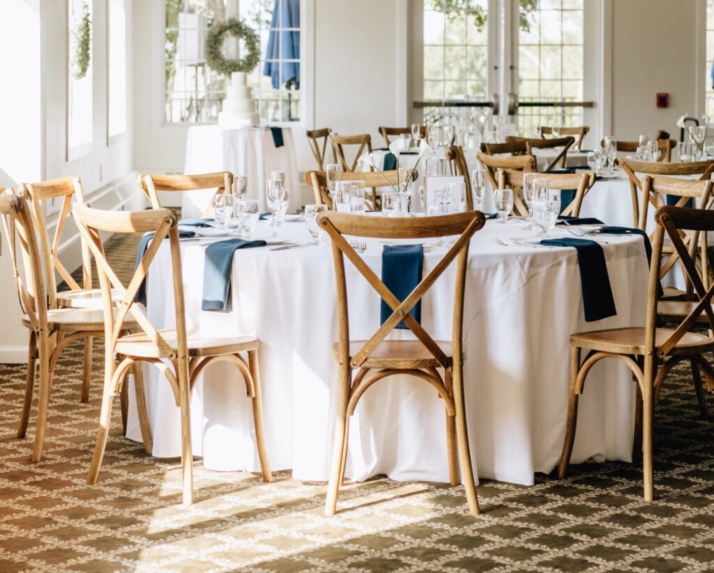 The ballroom at Flourtown Country Club set up for a reception with the space filled with sunlight